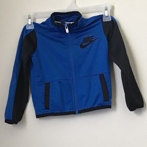 Nike pull over long sleeve shirt, 2 T, cobalt blue with black stripe on sleeves.